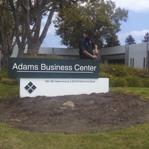 Bennett Graphics installing a monument Sign at Adams Business Center in San Leandro