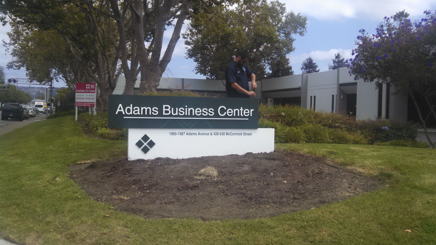 Bennett Graphics installing a monument Sign at Adams Business Center in San Leandro