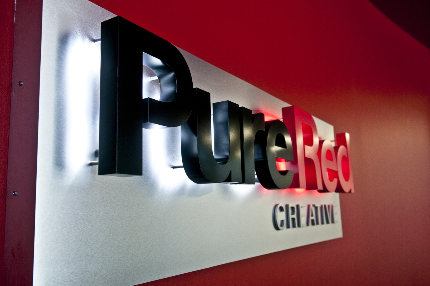 Pure Red Lobby Sign installed in Pleasanton